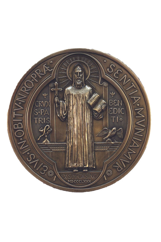 The front side of a St. Benedict Plaque in a bronze finish.