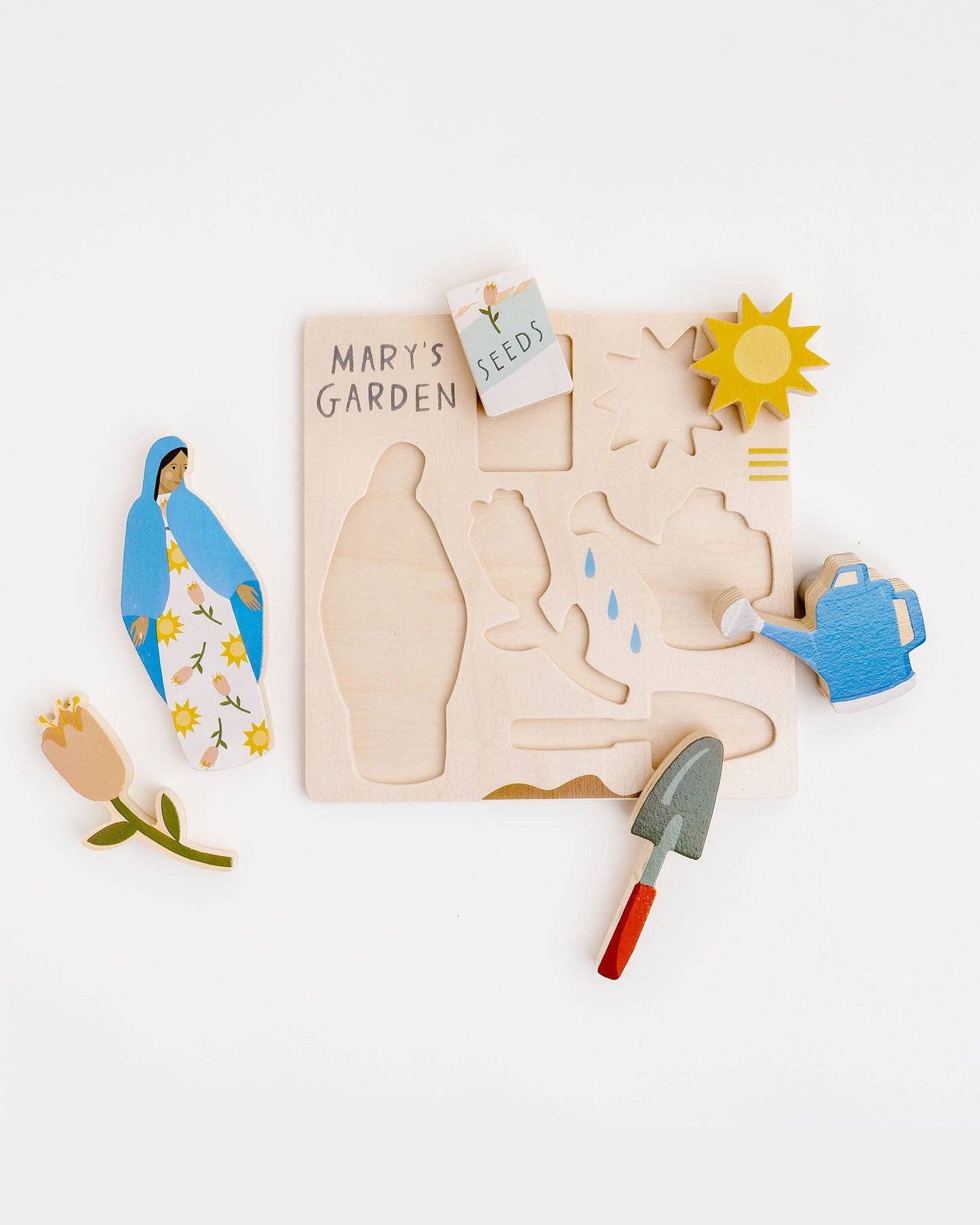 Mary’s Garden puzzle featuring Mary, Flowers, Shovel, Watering can, Seeds, and Sun.