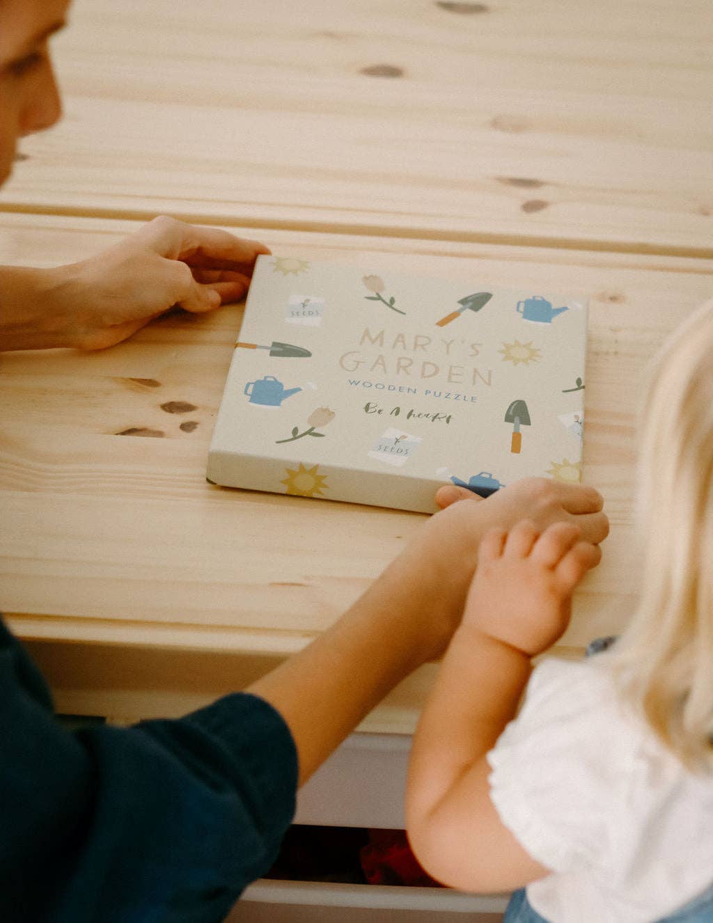A closed box showing the cover of Mary’s Garden Puzzle