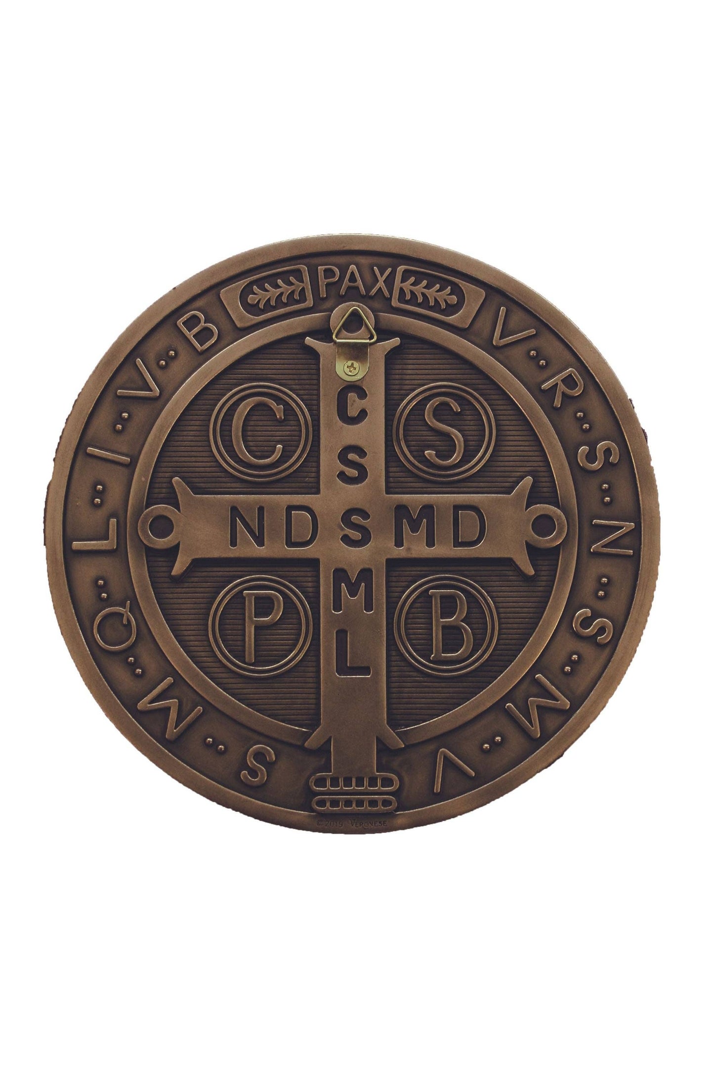The backside of a St. Benedict Medal in a bronze finish with a small triangle hanger located at the top of the cross to mount on wall.