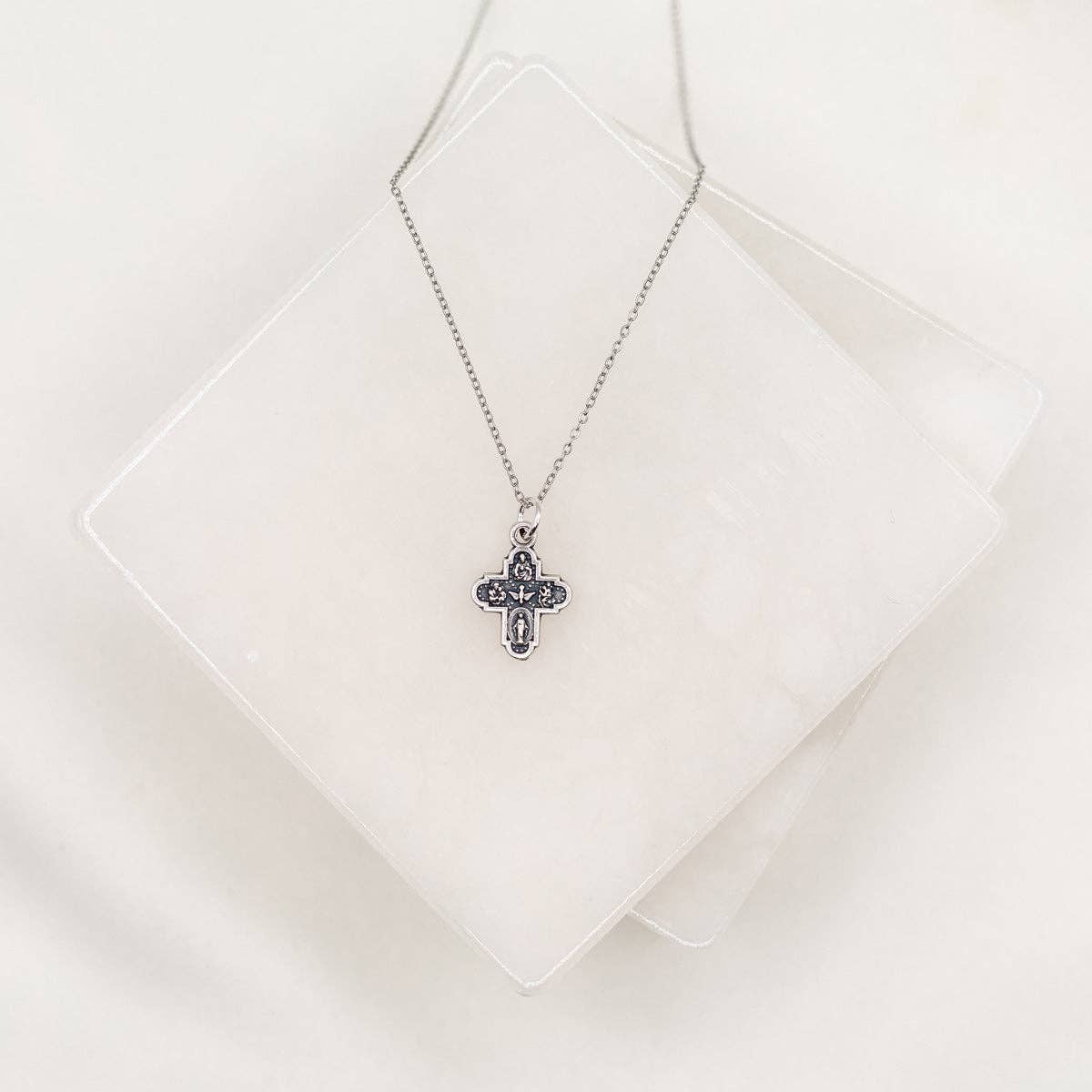 A silver 4-way cross chain necklace