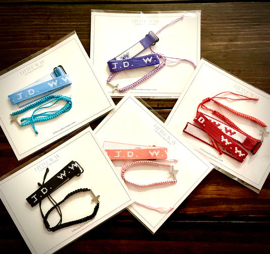 A variety of colors of W.W.J.D. bracelet sets