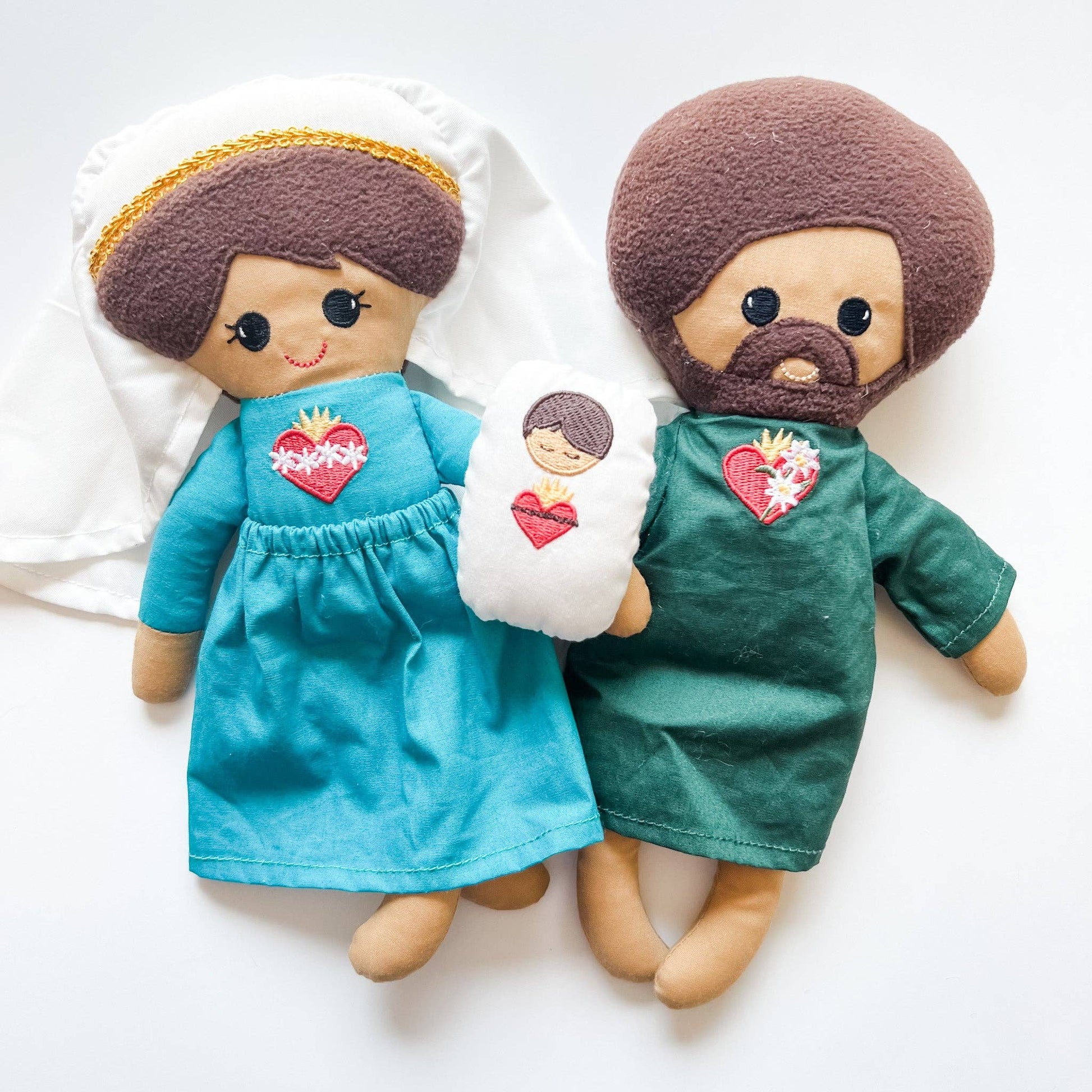Sacred Heart Family of dolls including Mary holding baby Jesus and Joseph