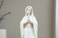 Adorning Virgin Mary Statue in white finish. Mary has her hands together in prayer. 