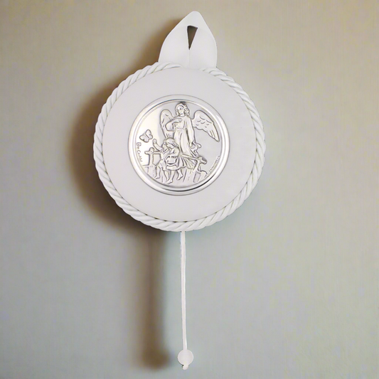 A White Round Baby Crib Medal featuring a guardian angel in silver, hanging on a white ribbon and rope.