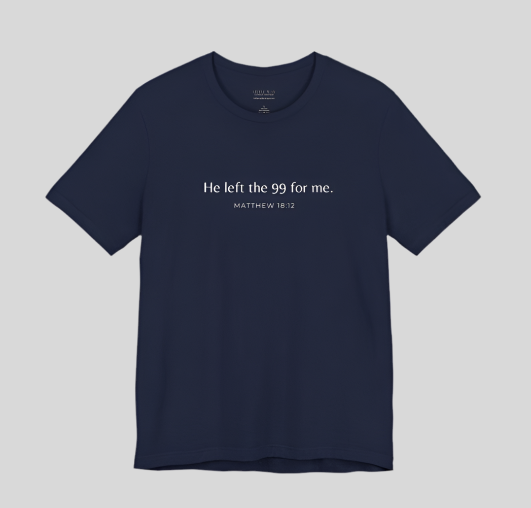 A navy blue shirt that reads "He left the 99 for me. Matthew18:12"