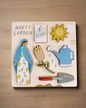 Mary’s Garden puzzle featuring Mary, Flowers, Shovel, Watering can, Seeds, and Sun. 