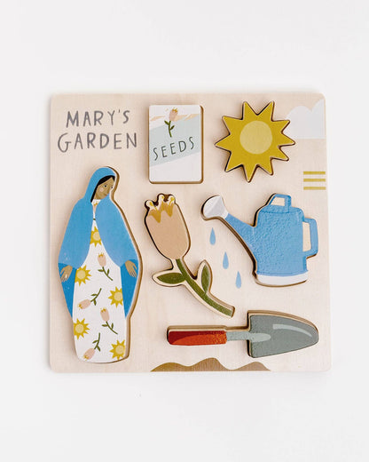 Mary’s Garden puzzle featuring Mary, Flowers, Shovel, Watering can, Seeds, and Sun. 