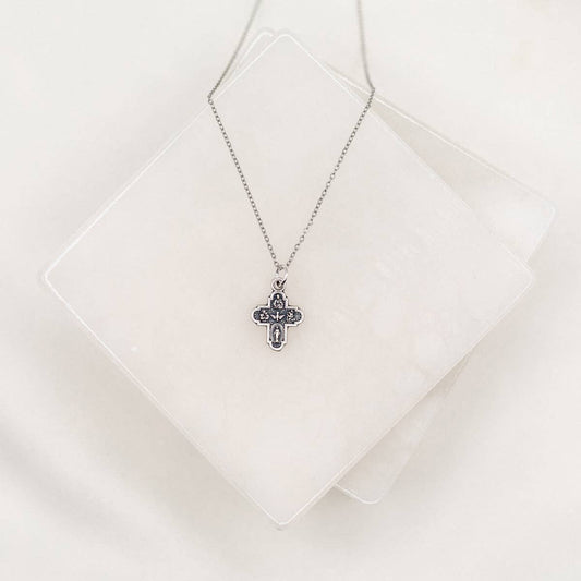 A silver 4-way cross chain necklace