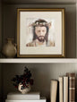 A bookshelf with books, plant, vase, and a framed art print of a Crowned Jesus in a gold frame.