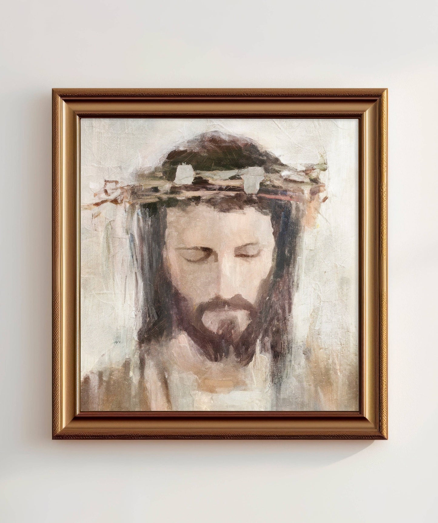 Artwork featuring a crowned Jesus in a gold frame.