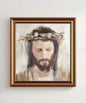 Artwork featuring a crowned Jesus in a gold frame.