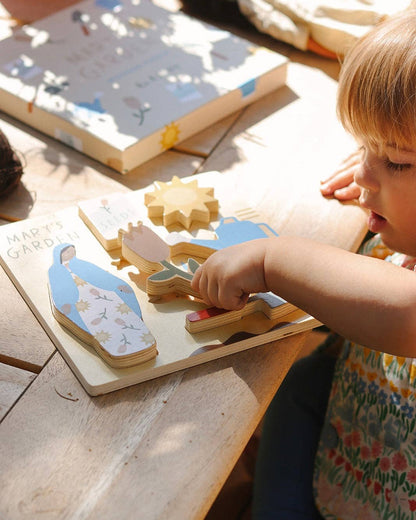 A child playing with Mary’s garden puzzle